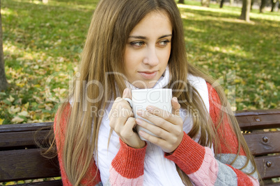 Girl holding coffee cup