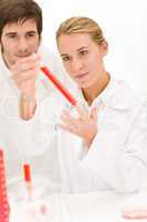 Scientists in laboratory - flu virus test tube