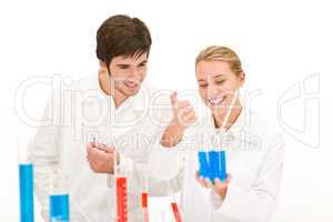 Scientists in laboratory test chemicals
