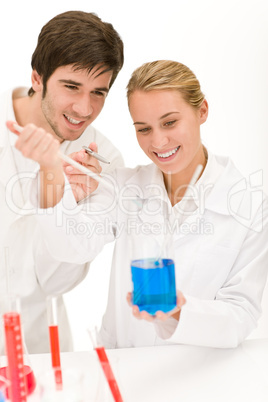 Scientists in laboratory test chemicals