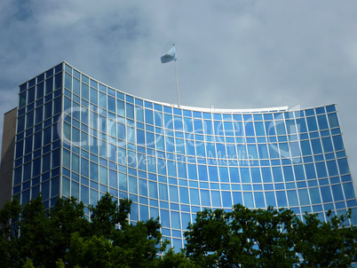 Modern office building with a onu flag