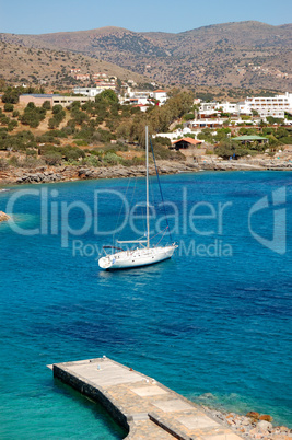 Yacht at the beach of luxury hotel, Crete, Greece