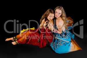 two attractive woman look at you in indian costume