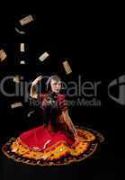 woman in traditional indian costume againist falling money