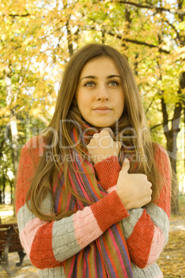 Autumn portrait of a beautiful young woman