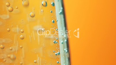 Mineral water air bubbles orange background abstraction