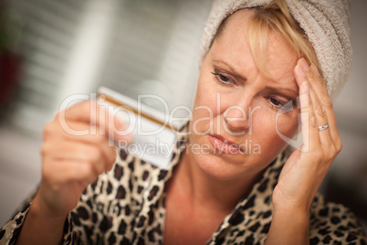 Upset Woman Holding Her Credit Card