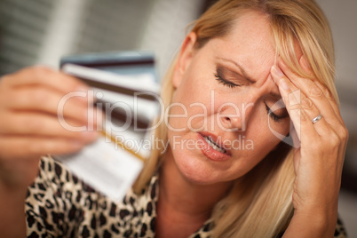 Upset Woman Holding Her Many Credit Cards