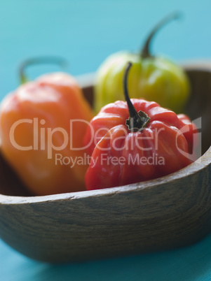 Scotch Bonnet Chilies In a Wooden Dish