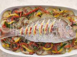 Whole Roasted Bream with Chilies Potatoes and Peppers