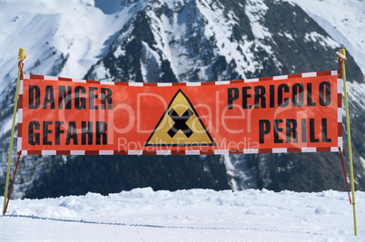 Warning sign in a snow covered area