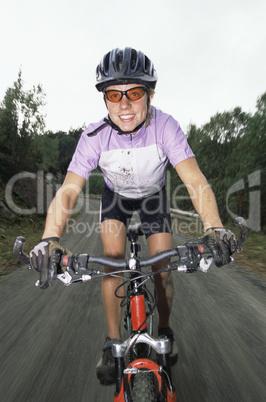 Young woman mountain biking