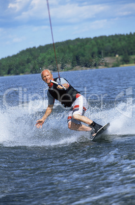 A young man water skiing