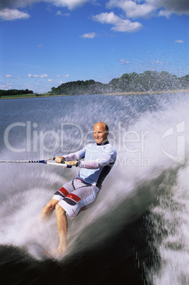 A young man water skiing