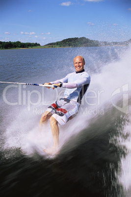 A young man water skiing