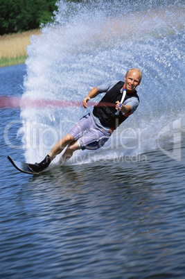 A young man water skiing