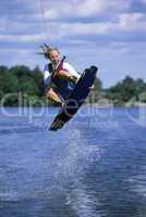 A young woman water skiing