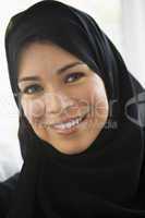 Portrait of a middle eastern woman wearing a black hijab