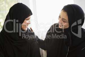 Two Middle Eastern women talking together