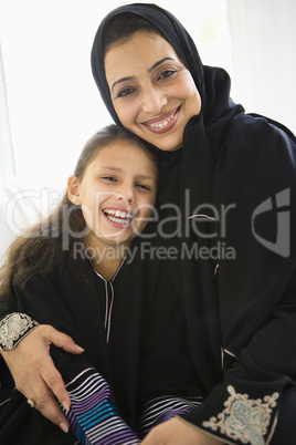 A Middle Eastern woman with her granddaughter