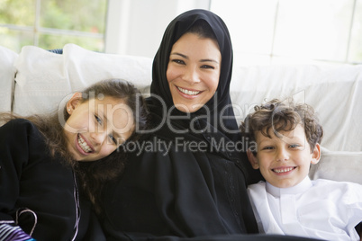 A Middle Eastern woman with her children