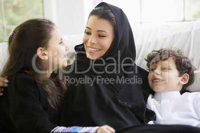 A Middle Eastern woman with her children