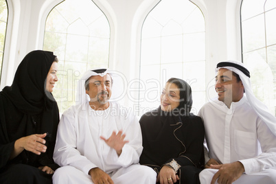 A Middle Eastern family sitting together