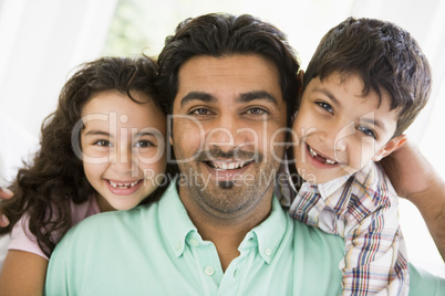 A Middle Eastern man with his children