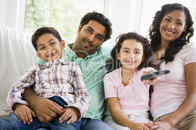 A Middle Eastern family watching television