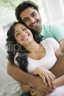 A Middle Eastern couple cuddling