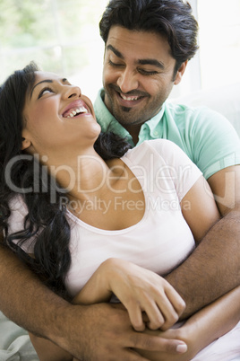 A Middle Eastern couple cuddling