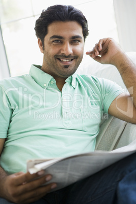 Portrait of a Middle Eastern man reading a newspaper