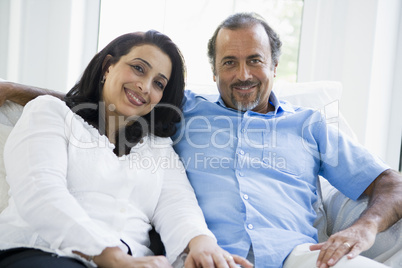 A Middle Eastern couple sitting at home