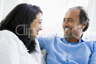 A Middle Eastern couple sitting at home