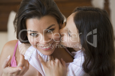 A Middle Eastern woman with her daughter