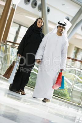 A Middle Eastern couple in a shopping mall