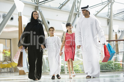 A Middle Eastern family in a shopping mall