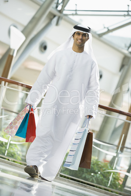 A Middle Eastern man in a shopping mall