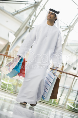 A Middle Eastern man in a shopping mall
