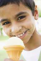 young middle-eastern boy enjoying ice-cream