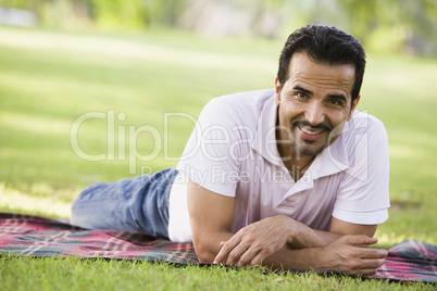 young man lying in the park