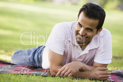 young man lying in the park