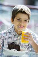 boy drinking orange juice