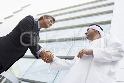 Businesspeople in front of tower building