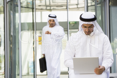 A Middle Eastern businessman using a laptop