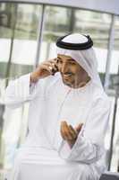 A Middle Eastern businessman using a cellphone
