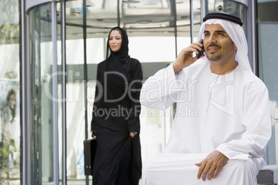 A Middle Eastern businessman using a cellphone