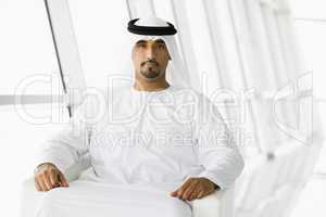 A Middle Eastern businessman looking at camera