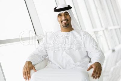 A Middle Eastern businessman looking at camera