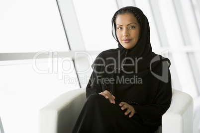 A Middle Eastern businesswoman looking at camera